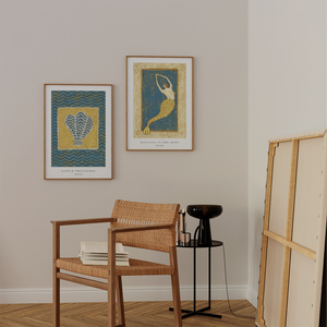 two blue and yellow colored art prints with ocean and mermaid themes 